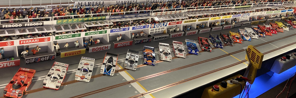 A packed field lines up in front of the pit lane
