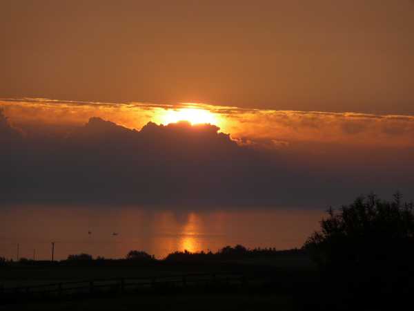 The sun rising over the bay