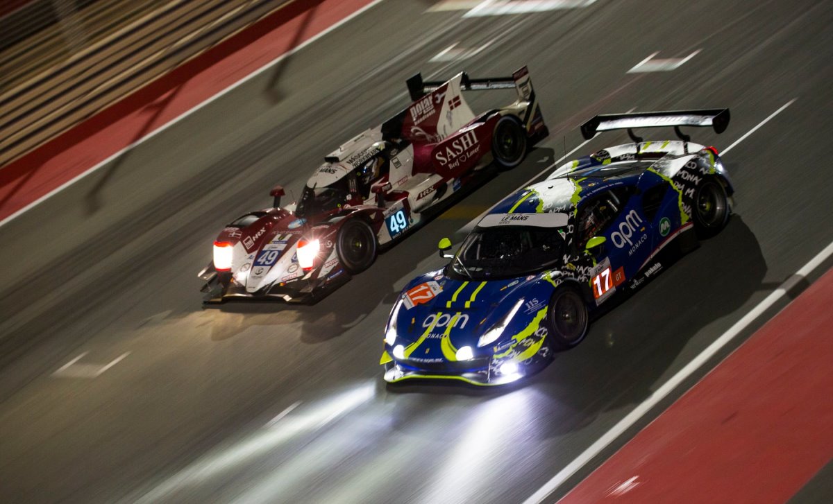 LMP2 and GT3 cars racing at night
